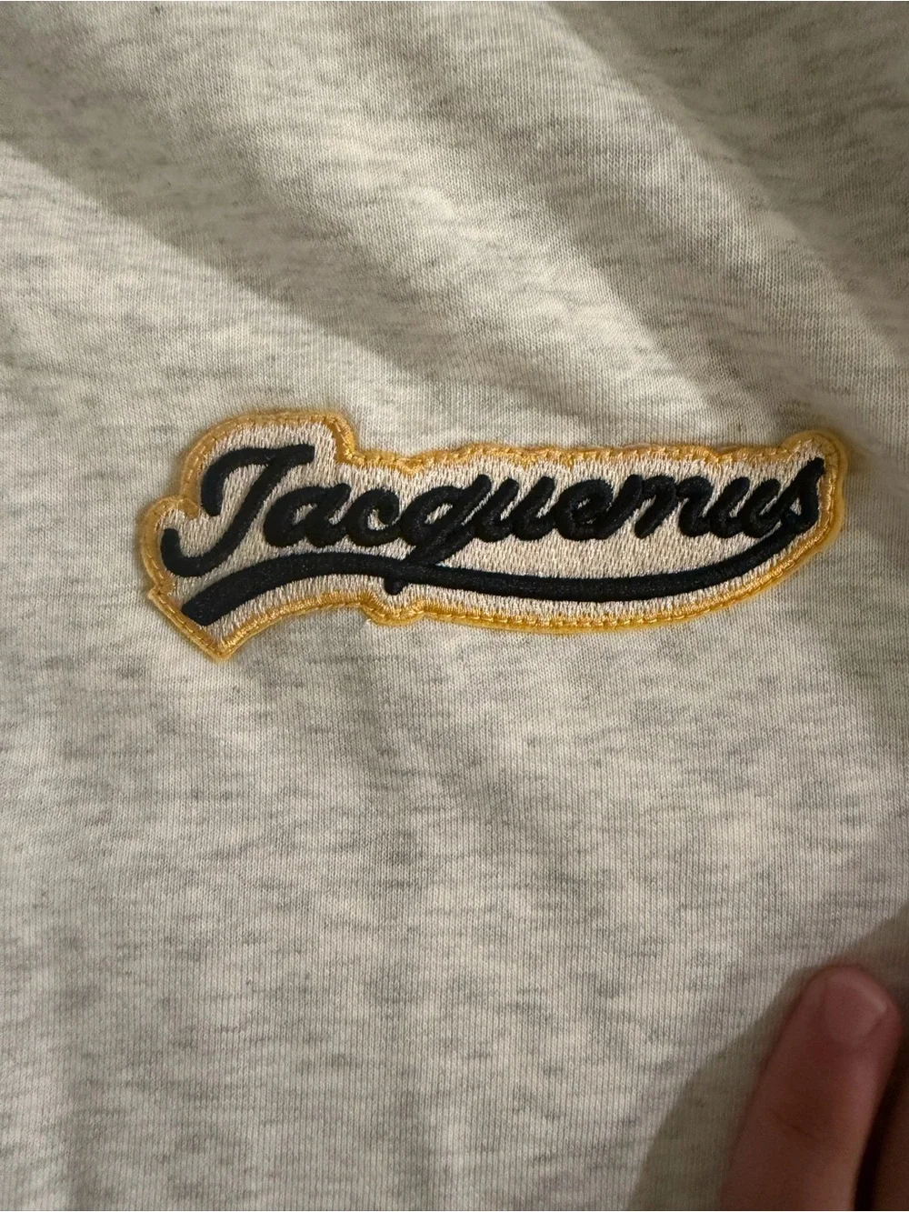 Jacquemus Light Gray Hoodie with Black and Yellow Logo